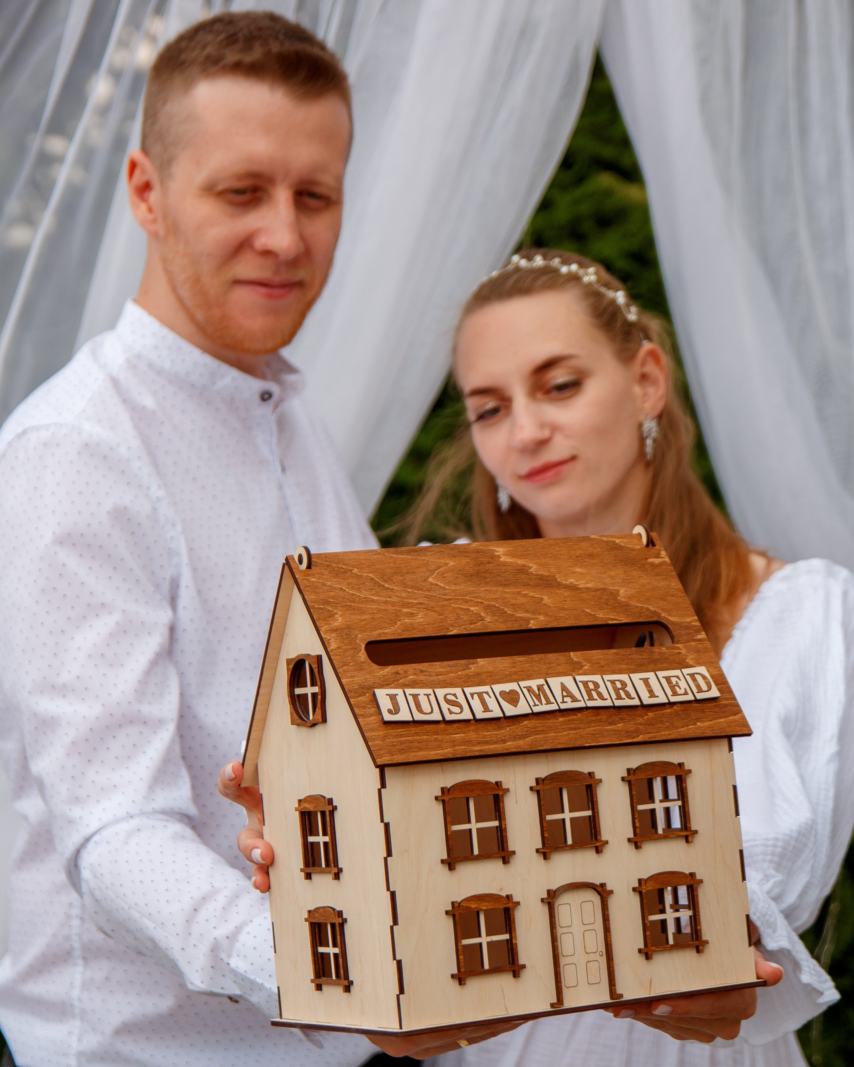 Decorative wooden house for wedding envelopes table