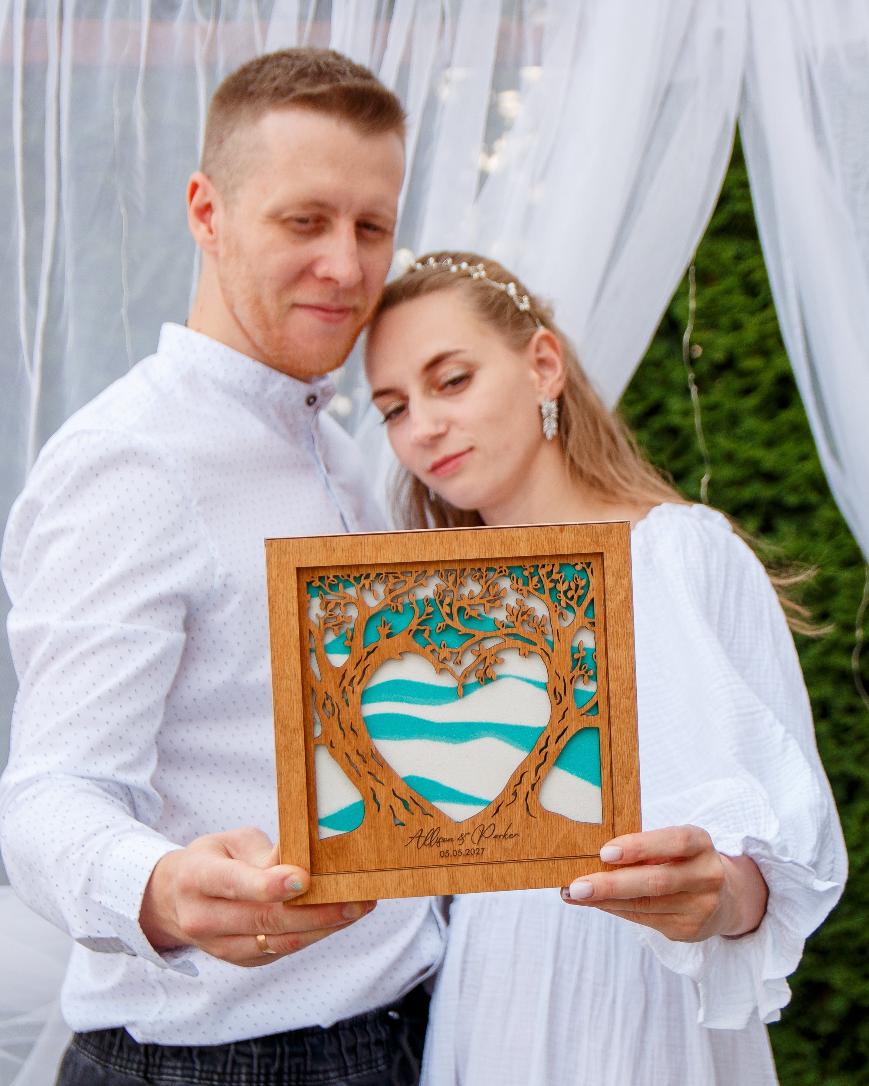 Wedding sand ceremony set with decorative bottles and frame