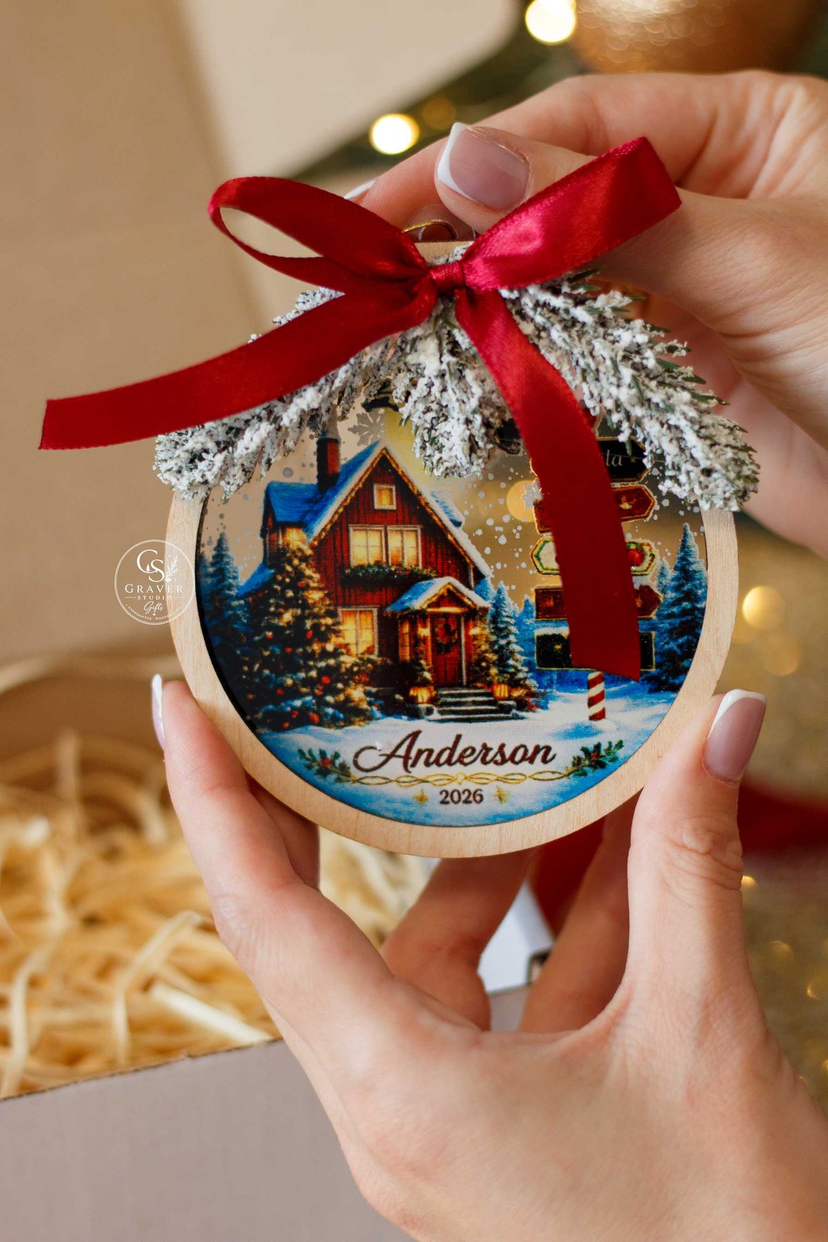 Personalized family Christmas ornament displayed in holiday gift packaging