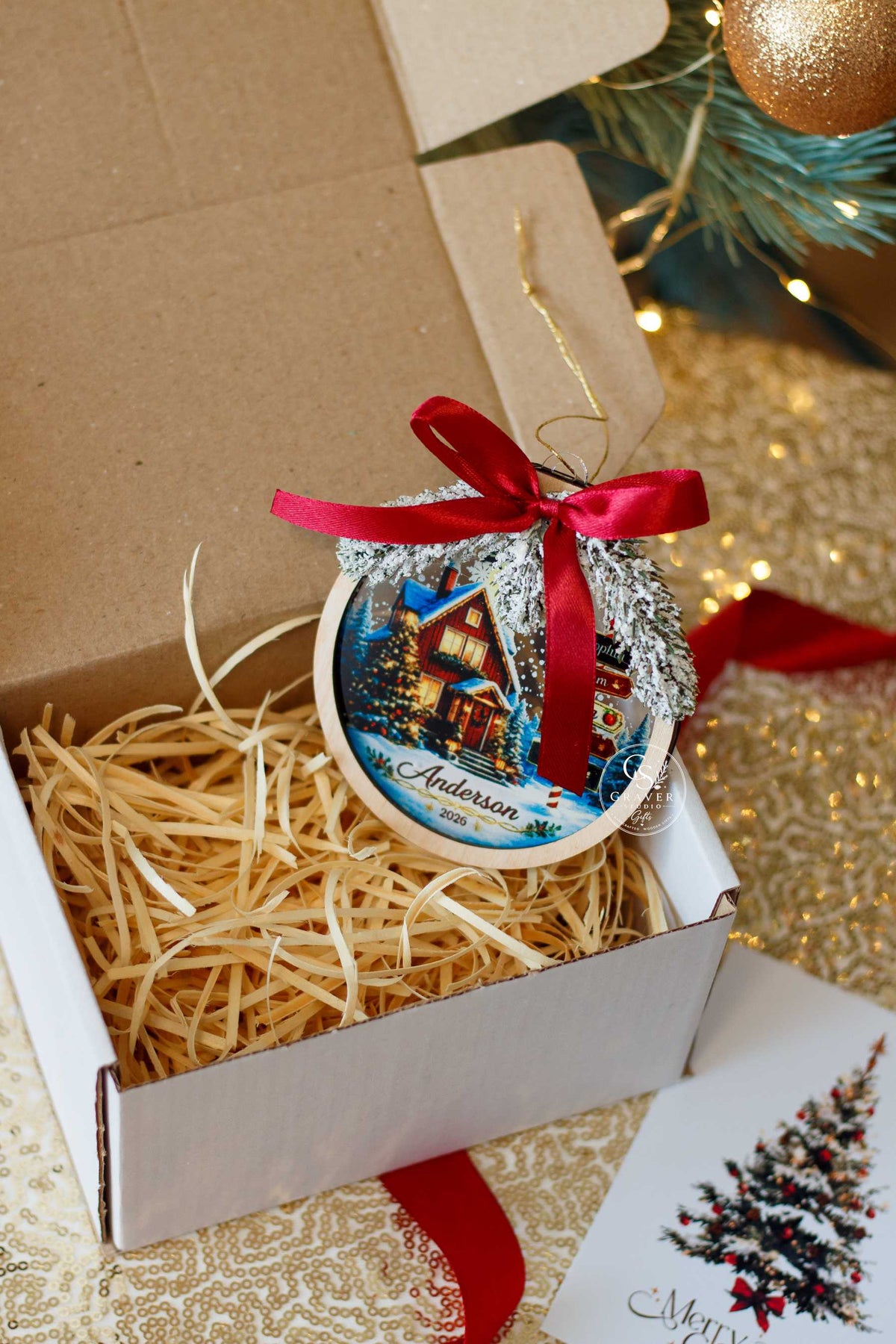 Personalized family Christmas ornament displayed in holiday gift packaging